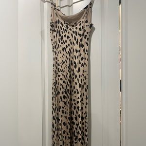 Elegant animal print spaghetti strap dress. New without tags. bought from Vici
